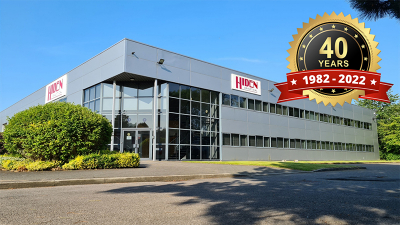 Photo of Hiden's factory with the 40th anniversary logo overlayed