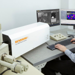 Photo of the inLux connected to a scanning electron microscope